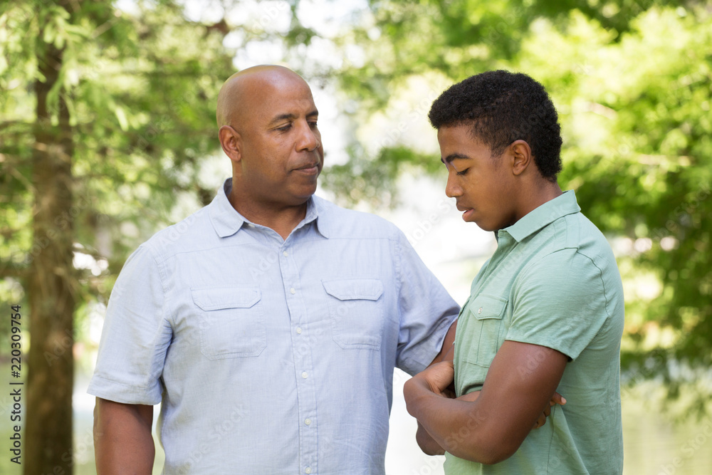 Father and son having a serious conversation. Father and son having a serious conversation.