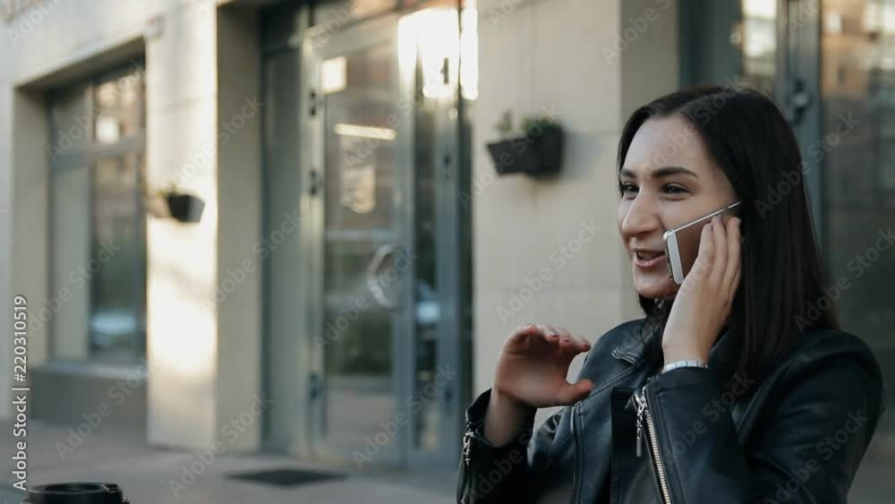 Young attractive woman talking on the phone. Young attractive woman talking on the phone.
