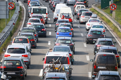 Fototapeta Naklejka Na Ścianę i Meble -  Rear view of traffic jam of lined up cars