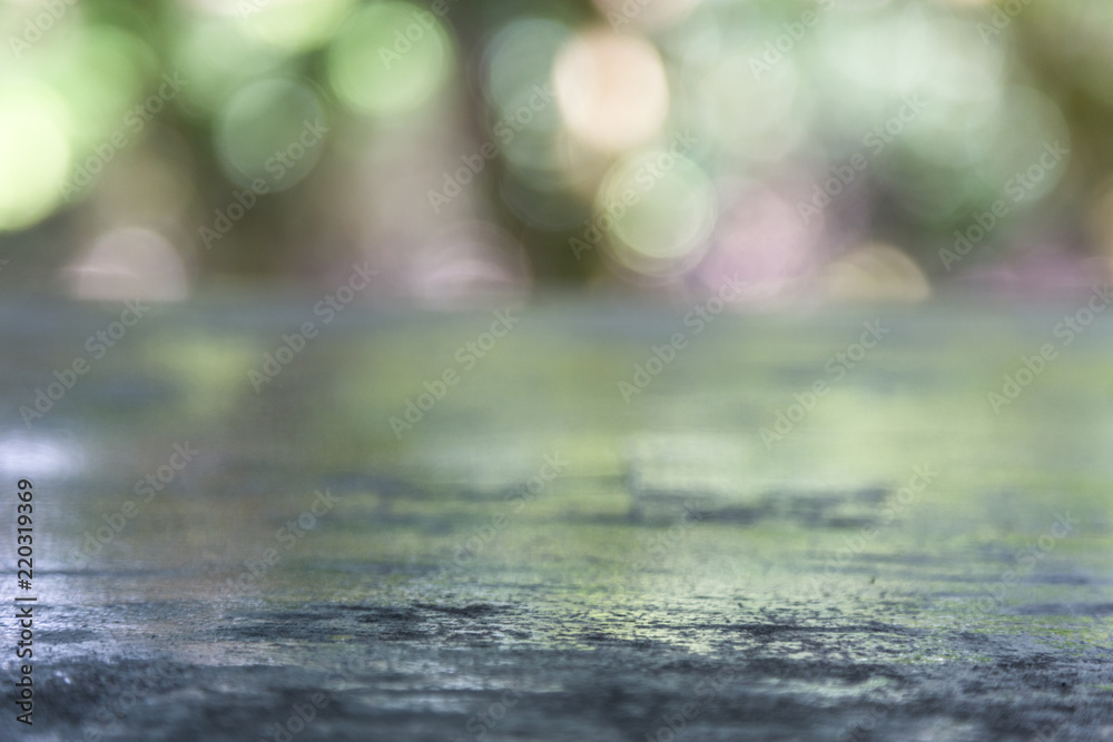 Wooden table top with blurred bokeh greenary nature background Wooden table top with blurred bokeh greenary nature background