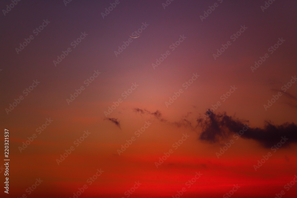Young Moon photographed from southern hemisphere above the ocean / sea horizon. Young Moon photographed from southern hemisphere above the ocean / sea horizon.