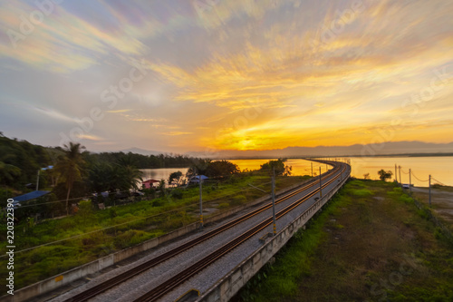 Beautiful Sunrise over sky at Floating Railway at Perak,Malaysia.soft focus,blur available when view at full resolution.