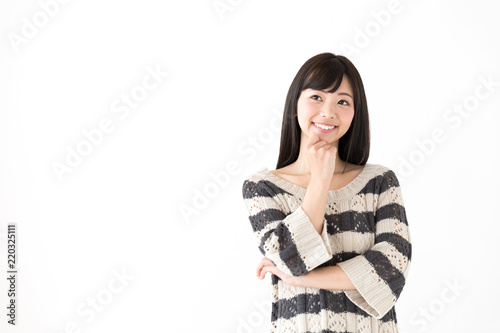 portrait of young asian woman thinking on white background