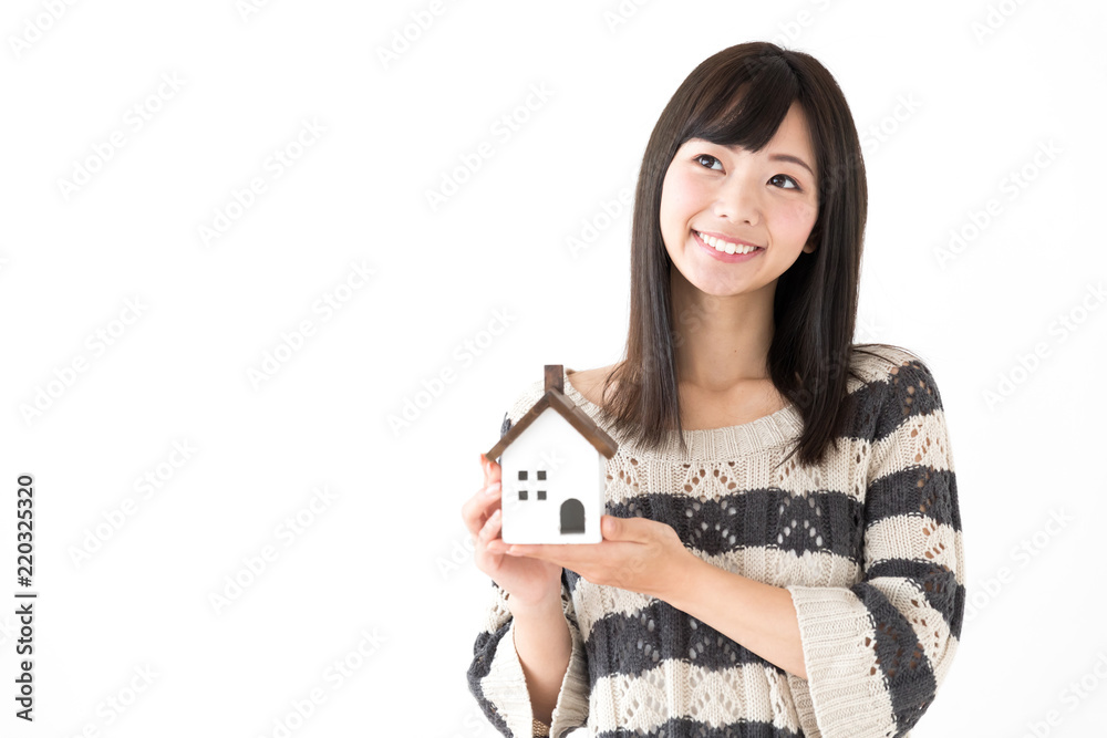 portrait of young asian woman holding miniture house on white background portrait of young asian woman holding miniture house on white background