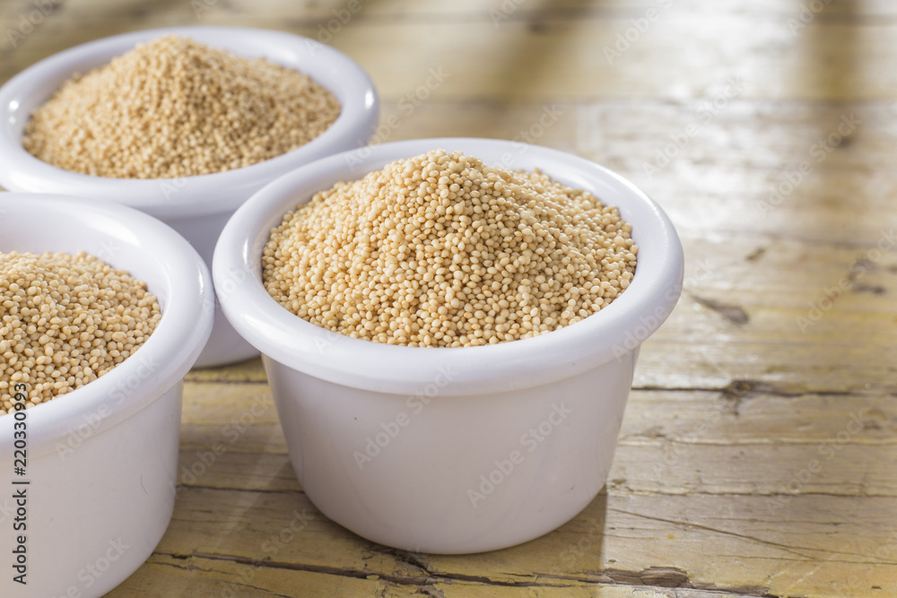 amaranth beans in bowl, on rustic wooden background amaranth beans in bowl, on rustic wooden background