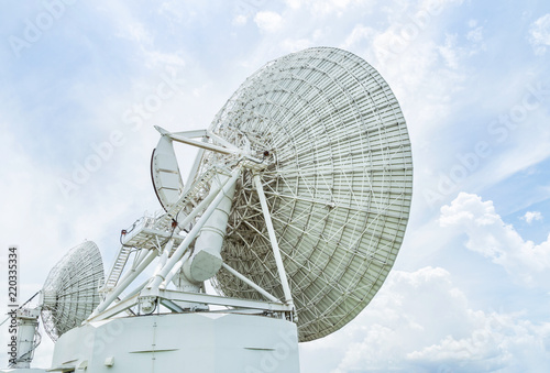 Fototapeta Naklejka Na Ścianę i Meble -  back side view big white satellite dish turn up skyward in communication center station