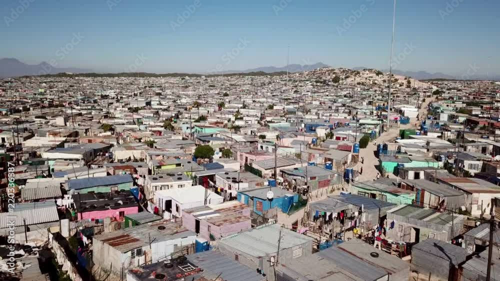 Aerial view across shacks in a township in South Africa