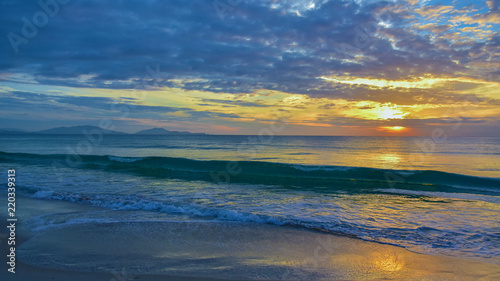 Sea waves and beautiful sunset © EVGENII