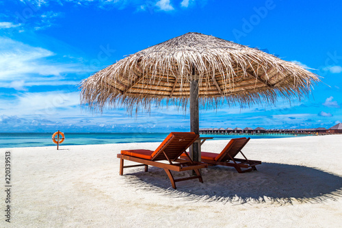 Sunbed and umbrella in the Maldives