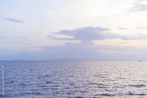 Seascape with sunset blue sky. Sunlight on water.