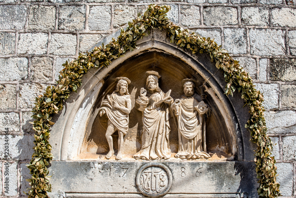 Bas-relief on an ancient Catholic Church in Dubrovnik,Croatia. 