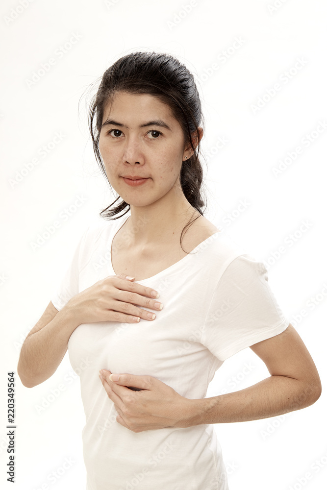 Woman examining herself for breast cancer Woman examining herself for breast cancer