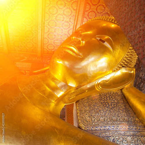 Reclining Buddha gold statue photo