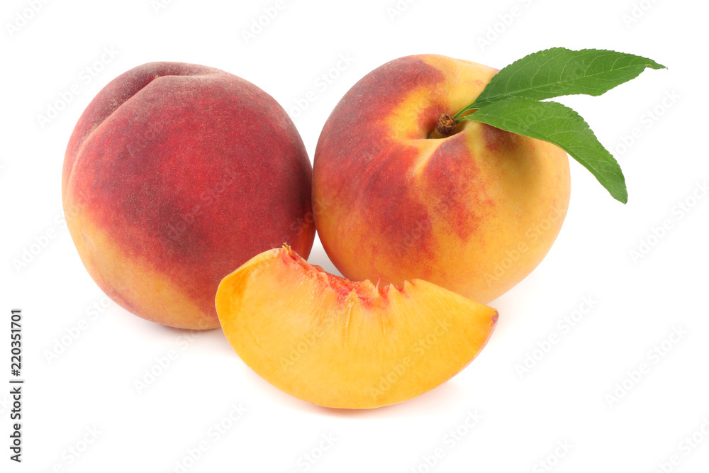 peach fruit with green leaf and slices isolated on white background peach fruit with green leaf and slices isolated on white background