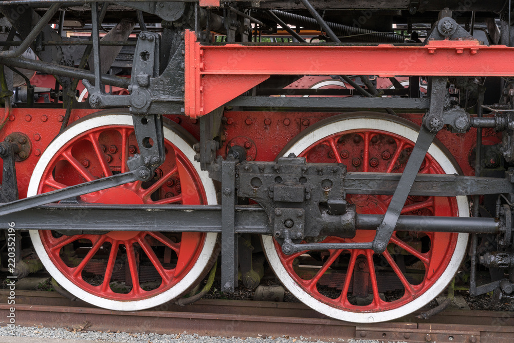 Old steam locomotive. Detail and close up of huge wheels.