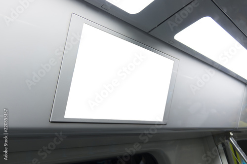 A blank lighted signboard inside a high speed train, with space for text.