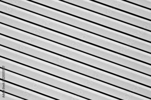 Plastic siding surface in black and white.