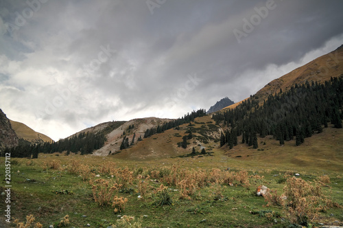 Panoramic view to Barskoon pass, river and gorge and Sarymoynak pass, Jeti-Oguz, Kyrgyzstan photo