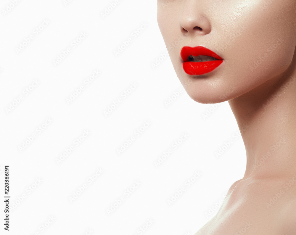 Fototapeta premium Woman health. Red Sexy Lips . Open Mouth. Makeup cosmetics. Make up concept. Beauty model girl's face isolated on white background. Filler injections. Lip augmentation, Beautiful Perfect Lips
