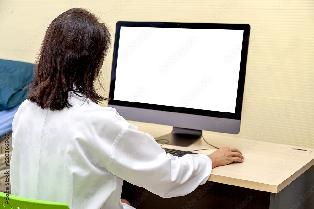 Doctor working on modern hospital. woman sitting and using modern computer with blank screen for text or product or business and idea you on desk office interior. Horizontal,mockup,copy space