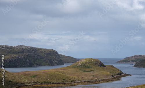 View on the North Coast 500 circular road around Scotland. Photo taken between Polbain and Lochinver in the Scottish Highlands, north west Scotland.