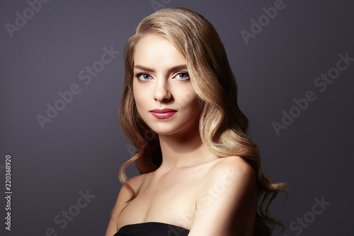 Woman with beautiful hairstyle curly blonde hair