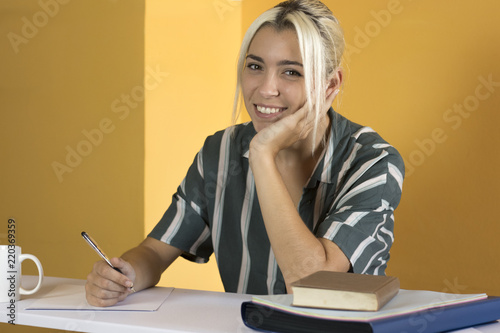 Satisfied employee looking at camera in the office photo