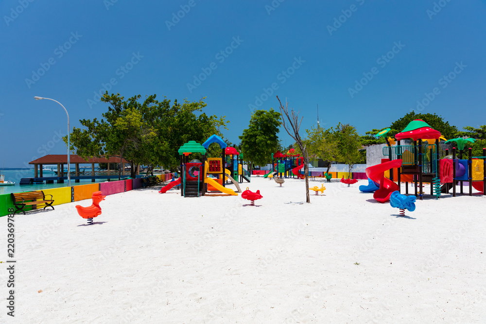 Colourful childrens playground on tropical island Colourful childrens playground on tropical island