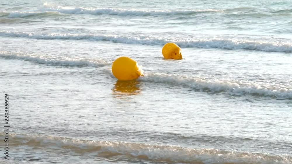 Yellow buoys floating in the mediterranean sea Yellow buoys floating in the mediterranean sea