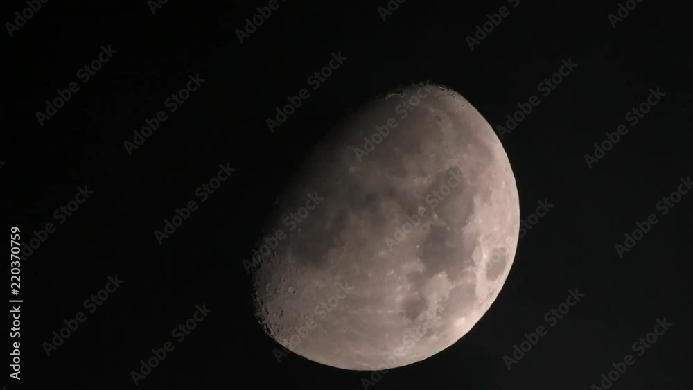 Clouds passing in front of a panning shot of the moon. Clouds passing in front of a panning shot of the moon.