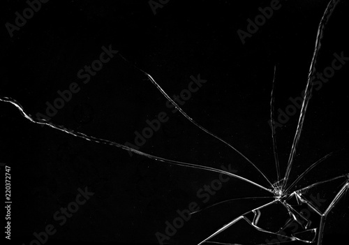Shards of a broken glass on a black background, shattered pieces. Useful texture in overlay mode. Horizontal shot.
 photo