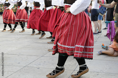 Women dancing and wearing one of the traditional folk costume from the Republic of Serbia
