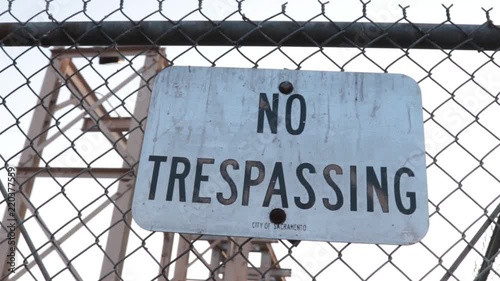 Cinematic shot of a no trespassing sign at an industrial location