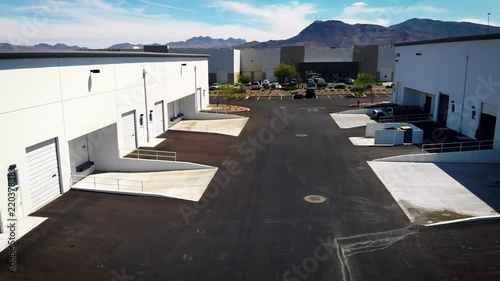 Forward moving drone shot of warehouse loading bay photo