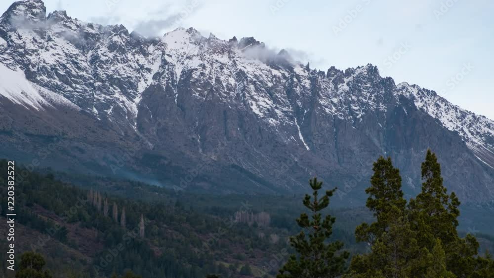 Mountain peak timelapse at sunset with forming clouds and green forest in Patagonia Argentina Mountain peak timelapse at sunset with forming clouds and green forest in Patagonia Argentina