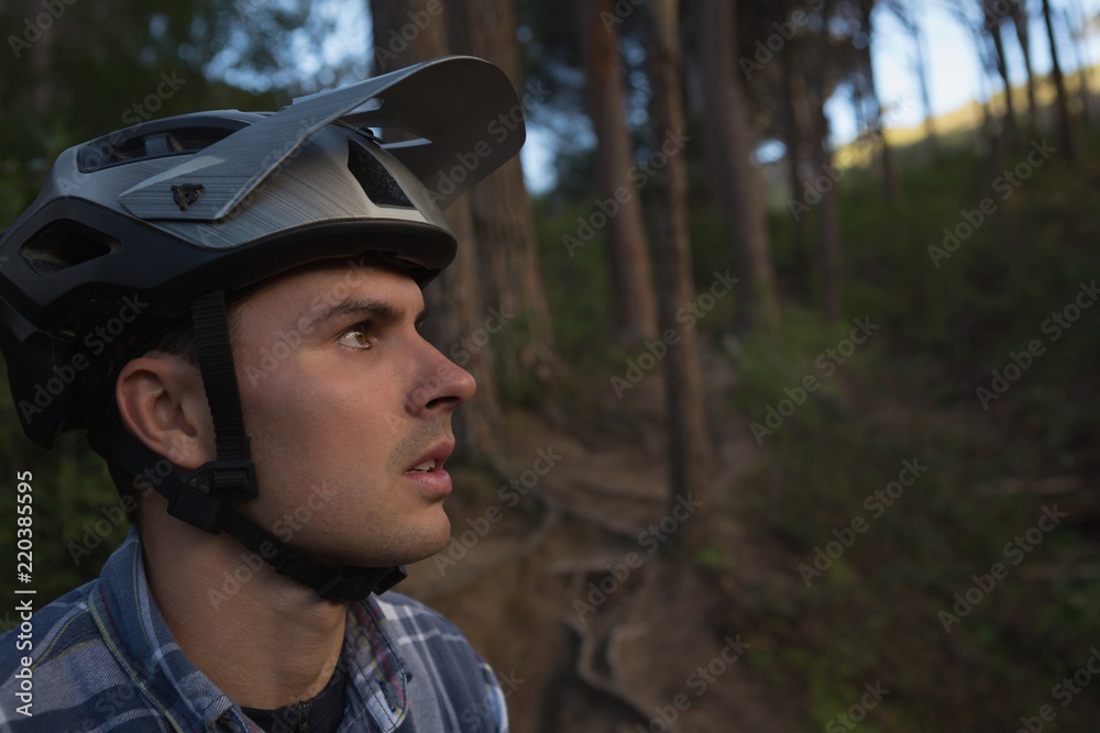 Man with helmet looking in lane Man with helmet looking in lane
