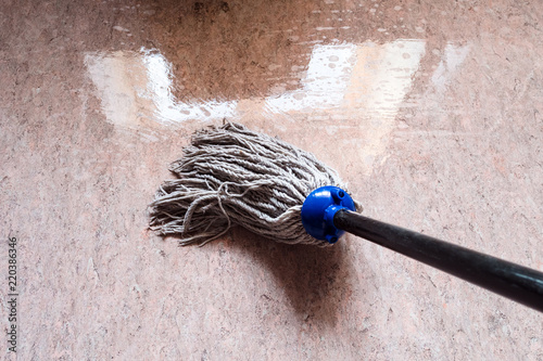 cleaning floor linoleum by rope mop