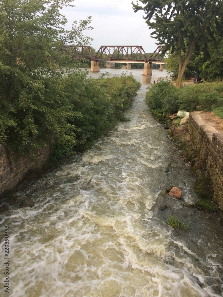 Fototapeta premium water flowing from dam into river