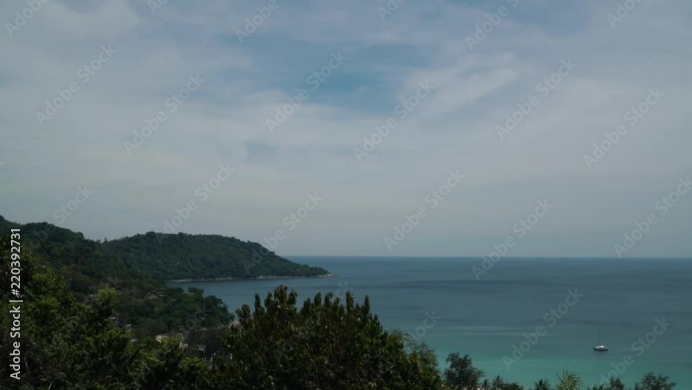 Time Lapse in Phuket, Thailand with boats moving in the background and leaves swaying Time Lapse in Phuket, Thailand with boats moving in the background and leaves swaying