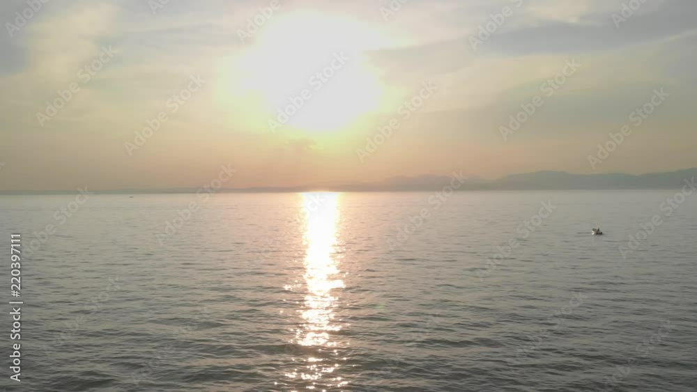 Drone flying over lake into sunset while a boat passes the frame. Shot on Garda Lake, Italy.
Shot in 4k 24fps Drone flying over lake into sunset while a boat passes the frame. Shot on Garda Lake, Italy.
Shot in 4k 24fps