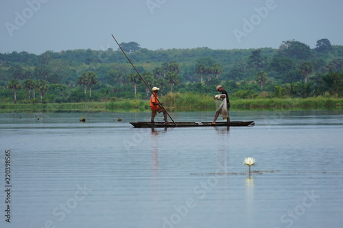 Fishermen in a conoe in the mono delta in Togo photo