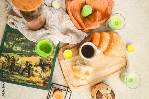 Flat lay composition with coffee and croissants.