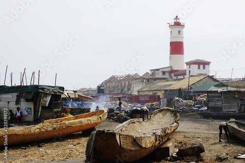 Fisher village in front of the lighthouse of Accra in Ghana photo