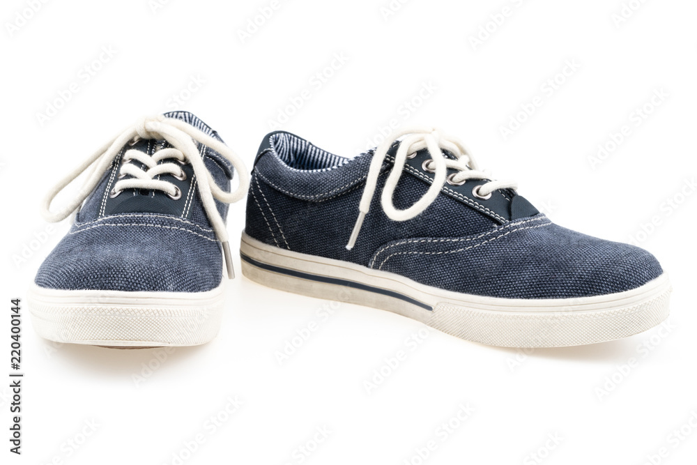 Picture of a pair of blue trainers over a white background.