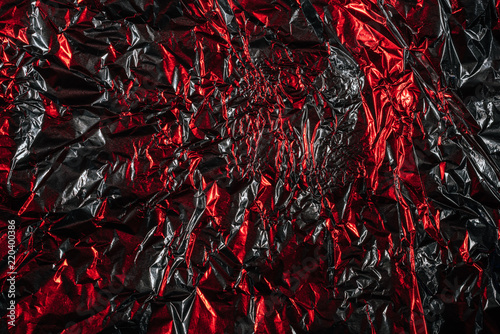 glittering abstract crumpled silver and red foil background