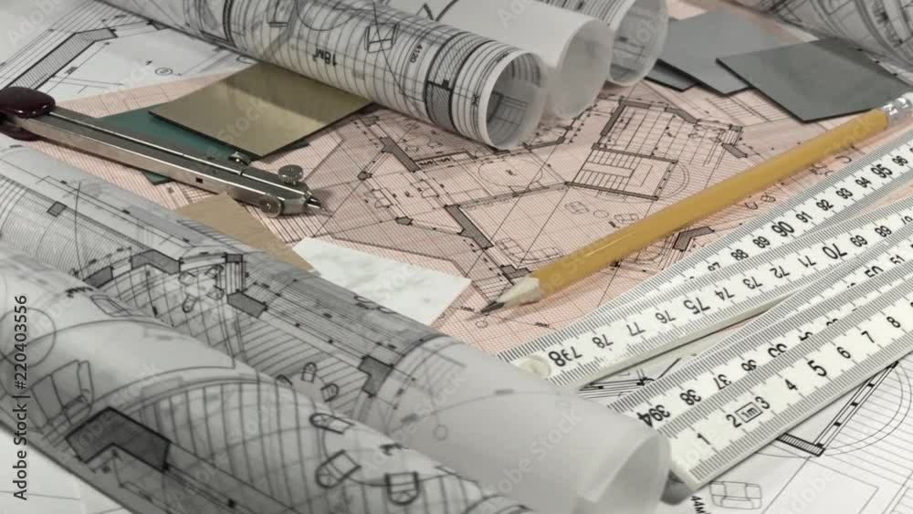 Blueprints: architectural drawings, yardstick - folding ruler & samples of modern interior decoration materials - decorative plastics smoothly rotate on the surface of the architectural plan Blueprints: architectural drawings, yardstick - folding ruler & samples of modern interior decoration materials - decorative plastics smoothly rotate on the surface of the architectural plan