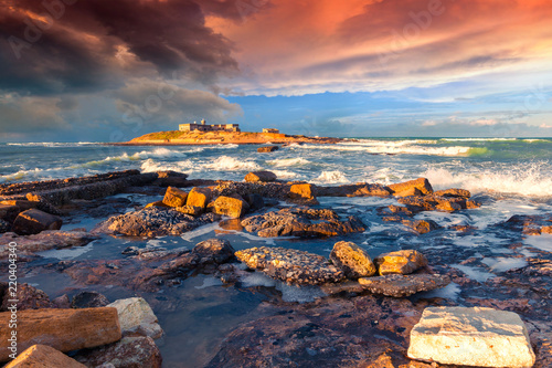 Dramatic spring sunrise on the Passero cape.