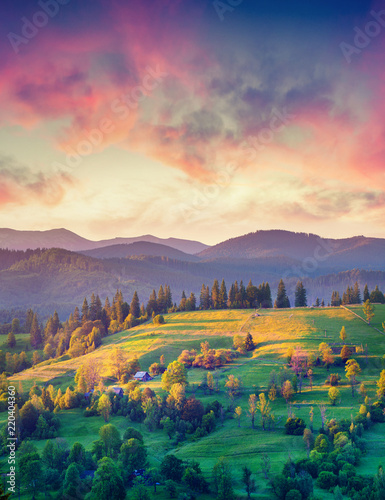 Colorful summer sunrise in the mountain village.