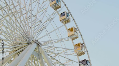 Silhouette shot of ferris wheel agaings gray sky. Autumn european festival. photo