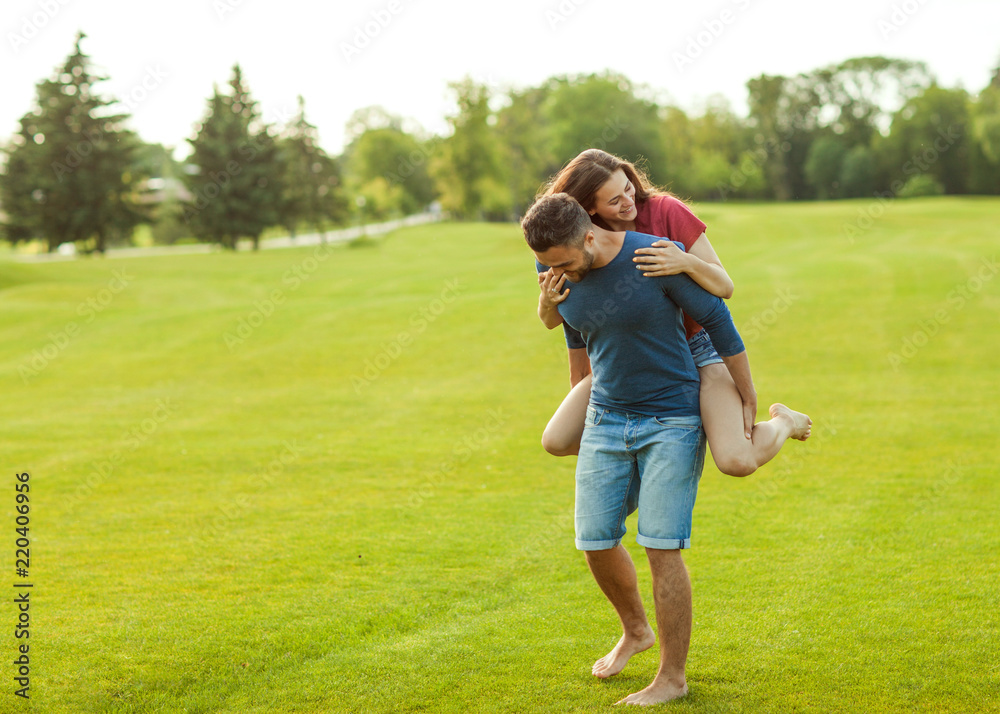 couple in love hugging in the park, concept of Valentine's Day couple in love hugging in the park, concept of Valentine's Day